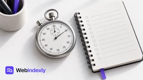A stopwatch beside a ruled work log with violet tabs.